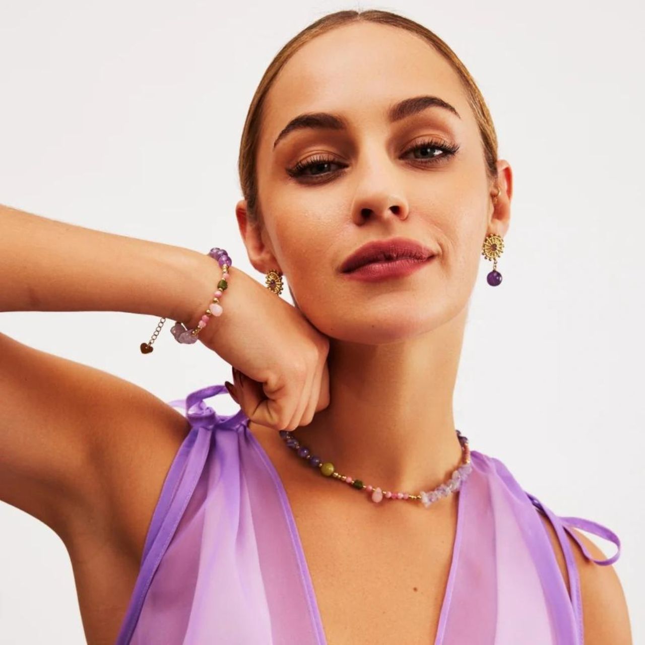 Expertly handcrafted by Knight & Day, these Semi Precious Amethyst Stone Earrings are a stunning addition to any jewellery collection. The unique amethyst stones offer a touch of elegance and timeless beauty, making them the perfect accessory for any formal or casual occasion. Elevate your style with these exquisite earrings.