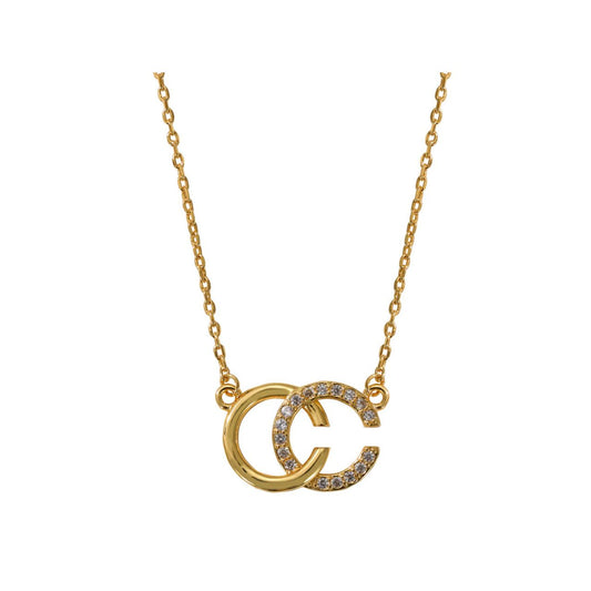 CC design pendant embellished with CZ stones. Length 16" + 2" extension. 18k gold plated.
