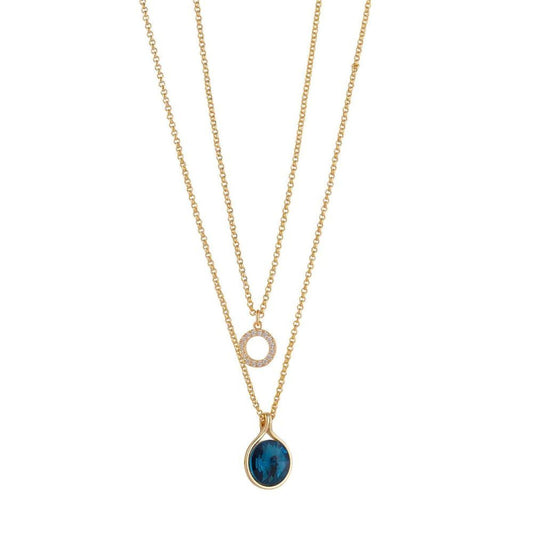 Yellow Gold Crystal & Sapphire Layered Necklace by Knight & Day   This beautiful yellow gold layered necklace by Knight & Day is a stunning statement piece, featuring crystals and sapphires intricately embedded in a delicate chain. Elegant and glamorous, this necklace adds a refined touch to any look.