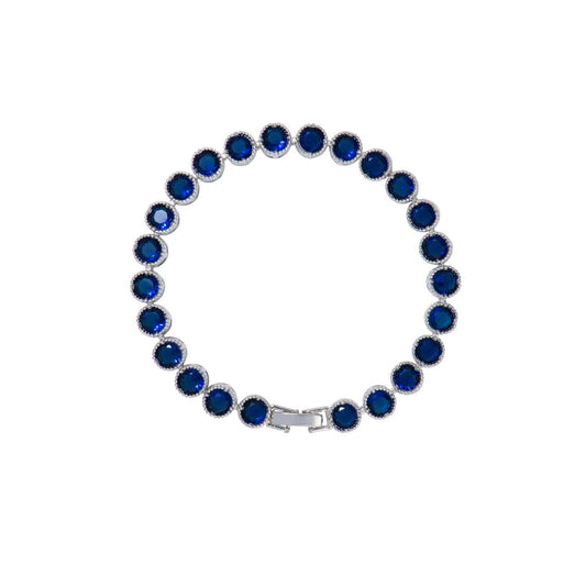Beautiful rhodium plated tennis bracelet with Sapphire CZ stones. Fold over clasp fastening.