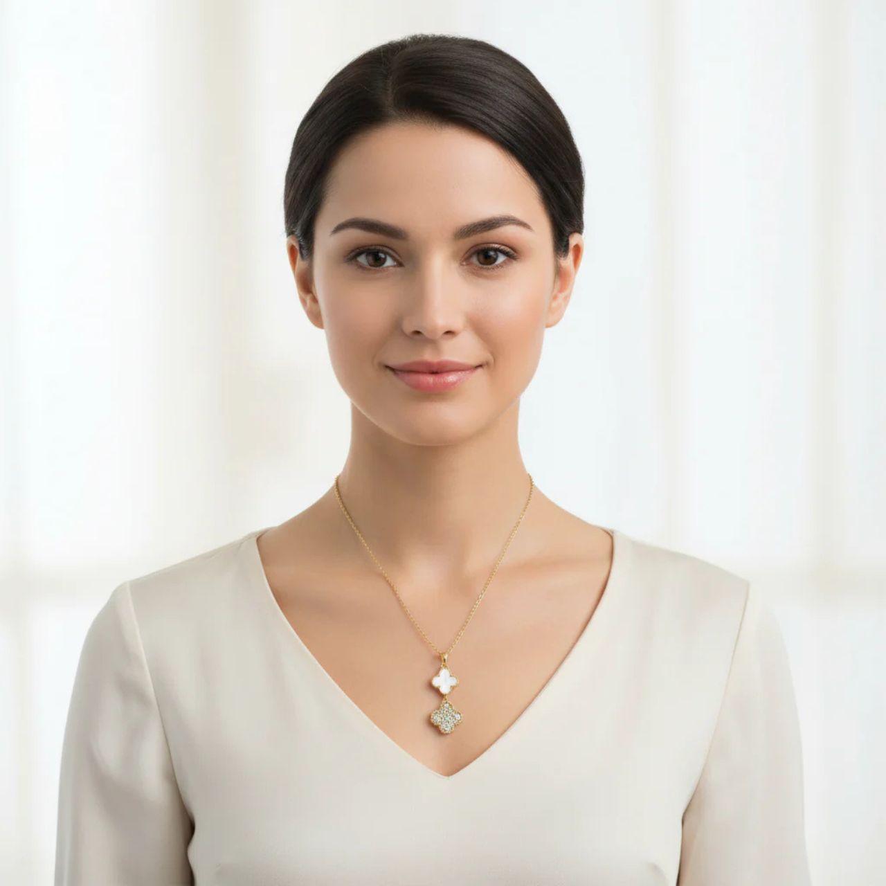 Delicate white and crystal clover pendant suspended on a fine chain. The charming four-leaf design catches the light beautifully, making it perfect for everyday wear or special occasions.