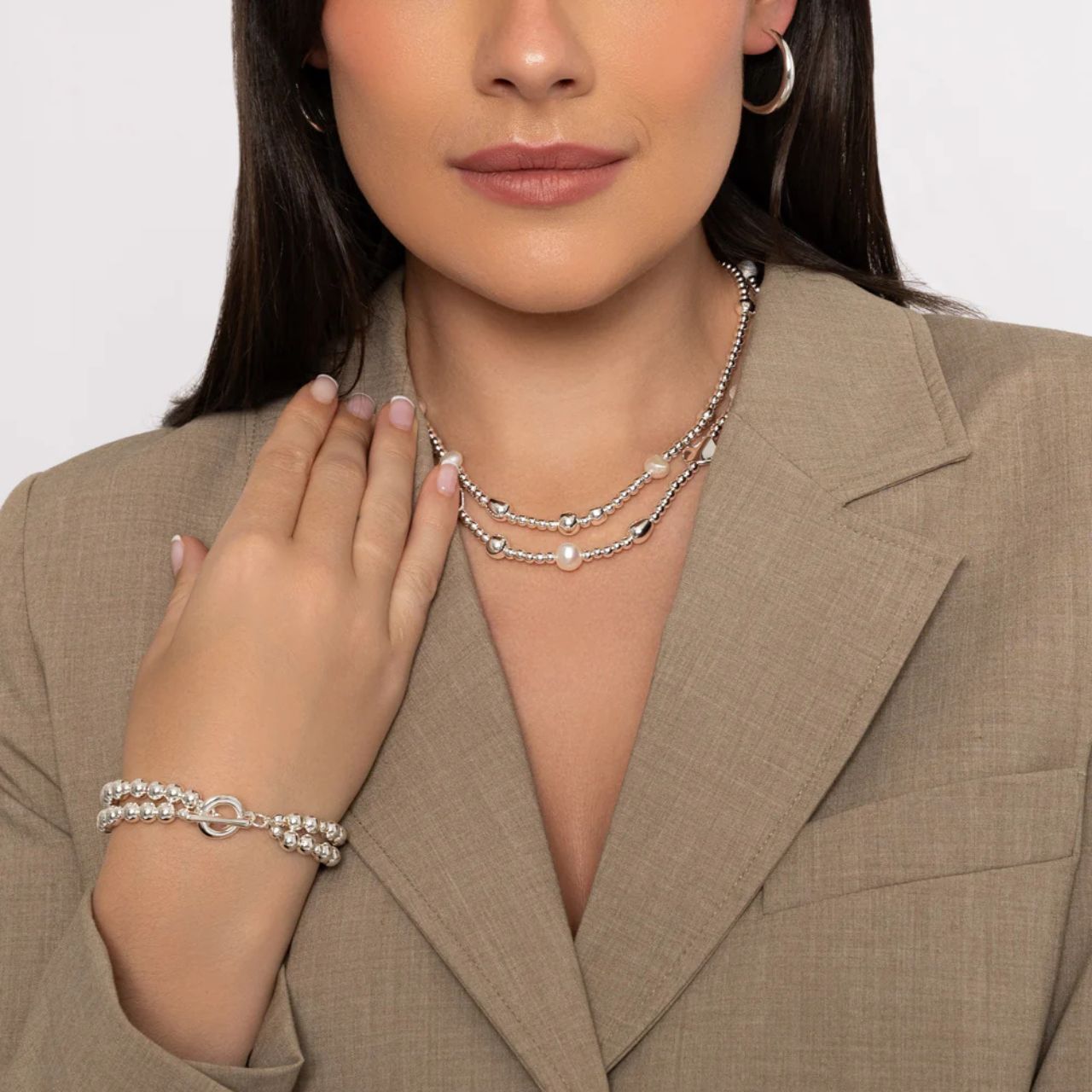 Beautiful double layer necklace with freshwater pearls &amp; silver plated beads. Lengths 42 + 44.5cm. Ring & toggle fastening.