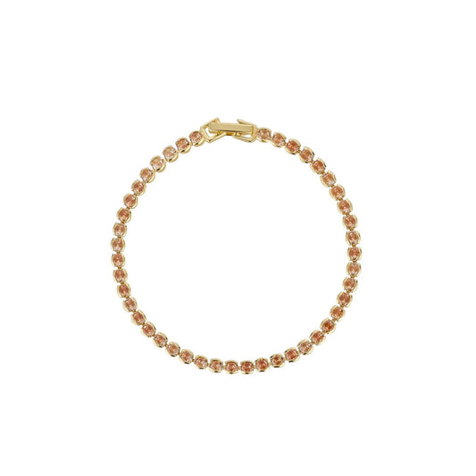 Miniature gold plated tennis bracelet with Champagne CZ stones. Elegant when worn alone and ideal for layering with watch or other bracelets.