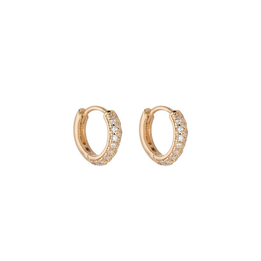 Upgrade your accessory game with Knight & Day's Gold Huggies Earrings. Crafted from gold plated, these earrings add a touch of elegance to any outfit. Featuring a comfortable and secure huggie design, these earrings are perfect for everyday wear. Elevate your style with Knight & Day.