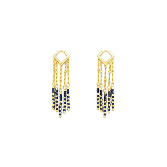 These Knight & Day earrings feature striking lapis lazuli semi-precious stones set in elegant gold plating. Designed with both post and clip fastenings, they offer versatile and secure wear. Their refined craftsmanship highlights the deep blue hues of lapis, making them a sophisticated choice for adding a touch of timeless elegance to any ensemble.