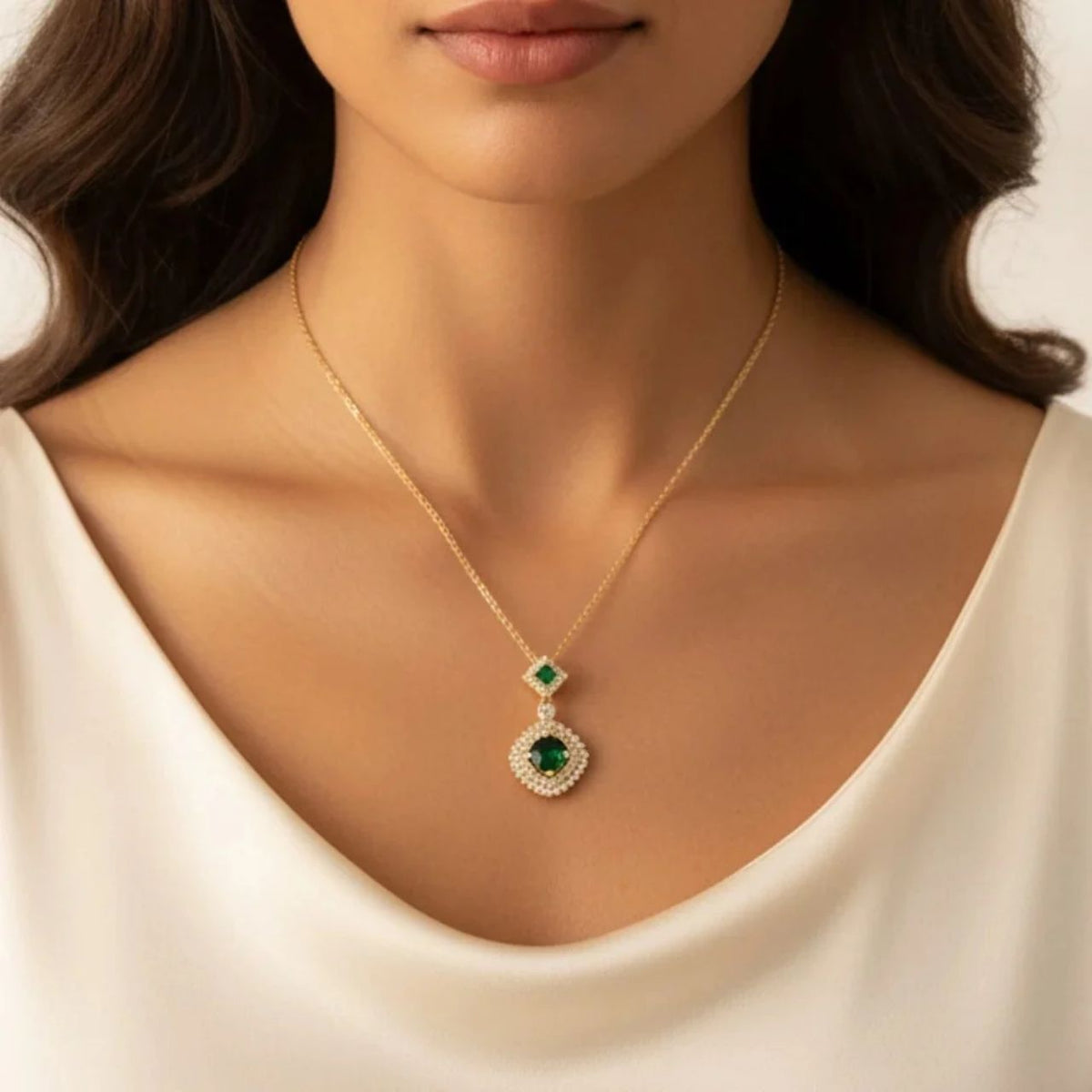 Vintage-inspired double drop pendant featuring stunning emerald crystals nestled among sparkling CZ stones in a diamond-shaped design. Finished with gold plating for timeless elegance. Adjustable length of 40cm plus 5cm extension chain for versatile styling.