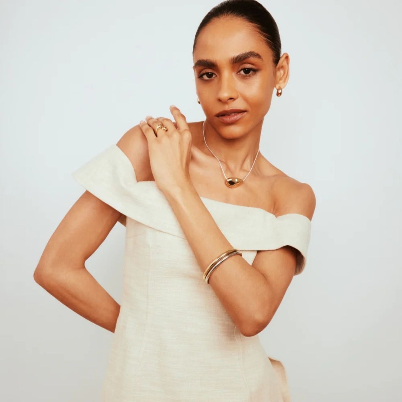 The Knight &amp; Day Kellie Silver Bangle combines refined craftsmanship with timeless elegance. Crafted from high-quality silver, this bangle offers a sleek, polished finish that complements both casual and formal attire.