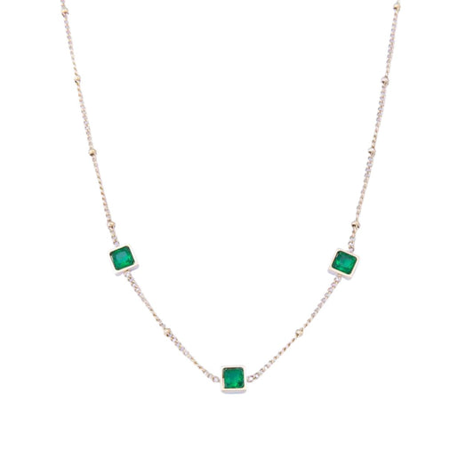 Leilani Emerald Necklace by Knight & Day   The Knight & Day Leilani Emerald Necklace is plated with luxurious 14K yellow gold for a stylish yet timeless look. The lustrous green stones provide a radiant contrast and create a striking statement piece.
