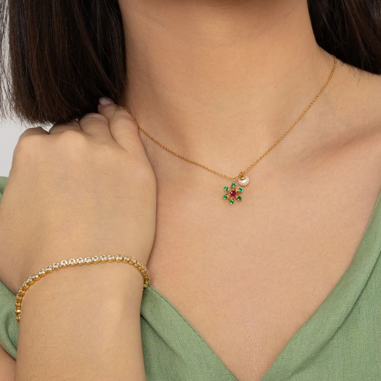 Pretty Floral shaped drop with emerald & rose CZ stones.