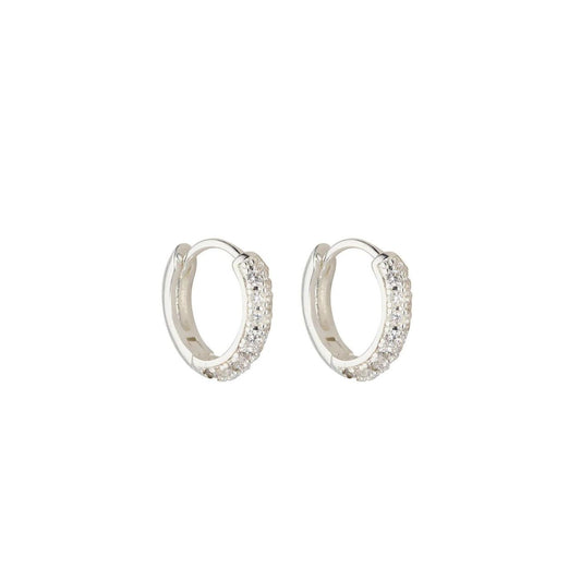 Experience elegance with Knight & Day Silver Huggie Earrings. Made with high-quality silver, these huggies provide a comfortable and secure fit. Perfect for any occasion, add a touch of sophistication to your look with Knight & Day.