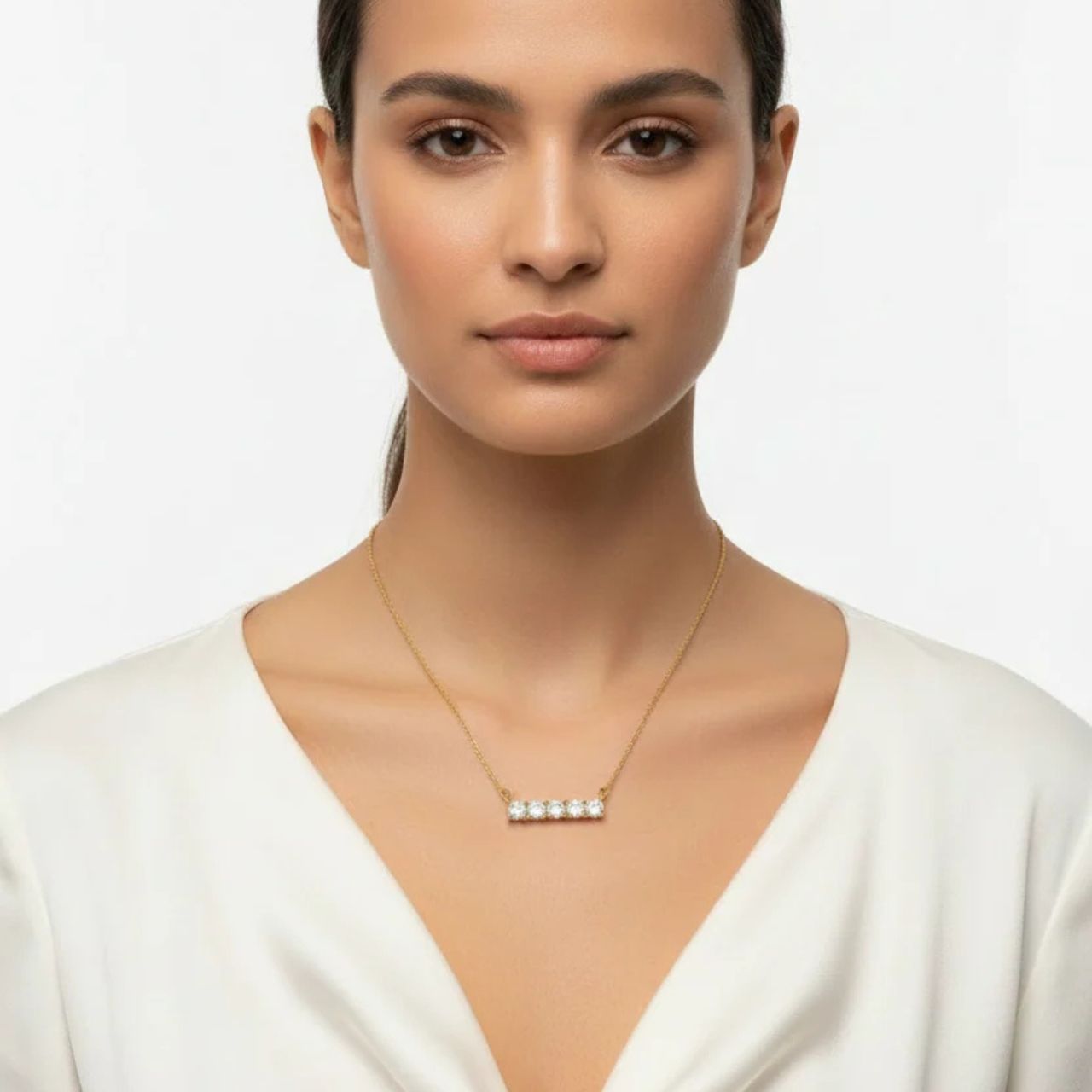 Beautiful crystal bar encrusted with 5 CZ stones. Length 16" + 2" extension. 18k gold plated.