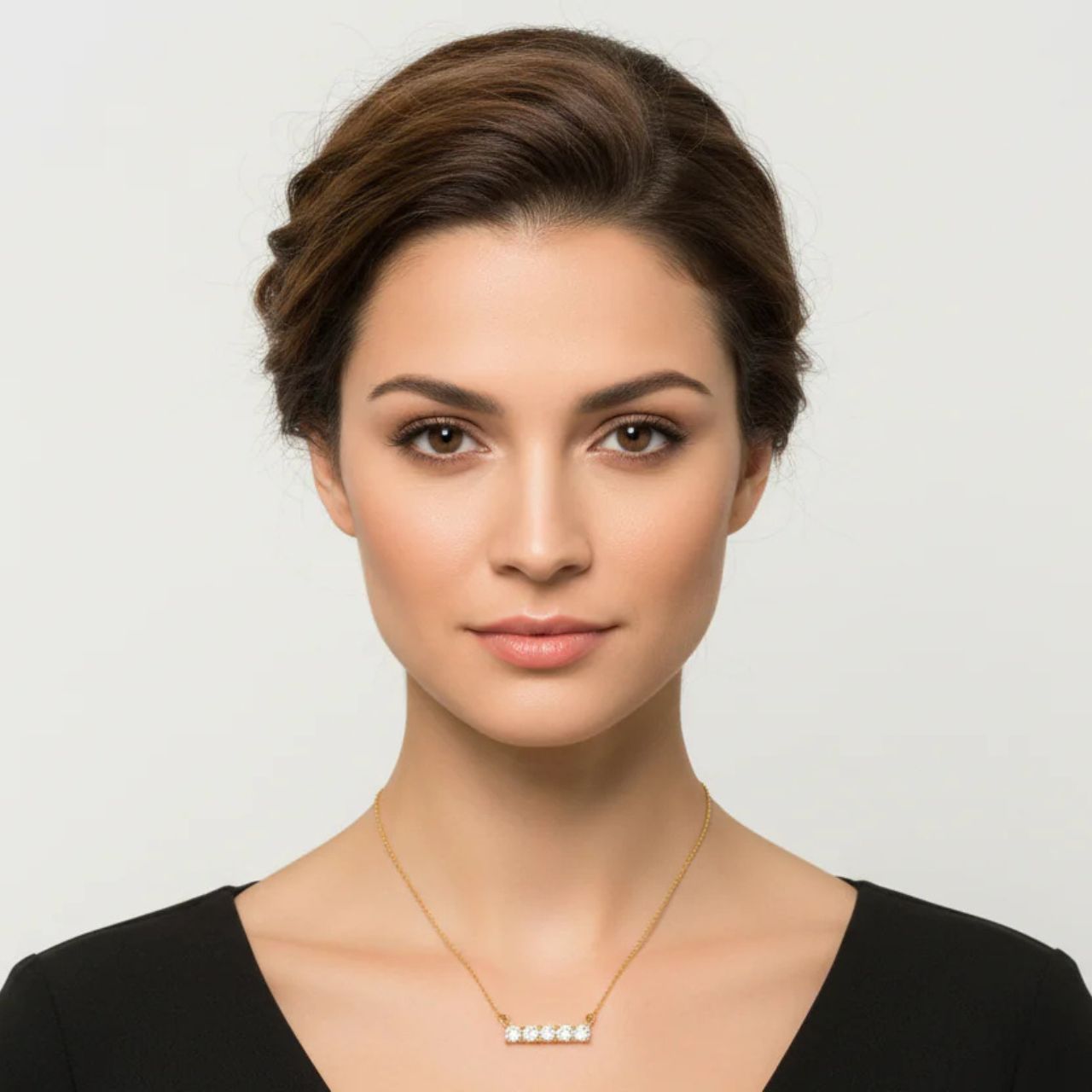 Beautiful crystal bar encrusted with 5 CZ stones. Length 16" + 2" extension. 18k gold plated.