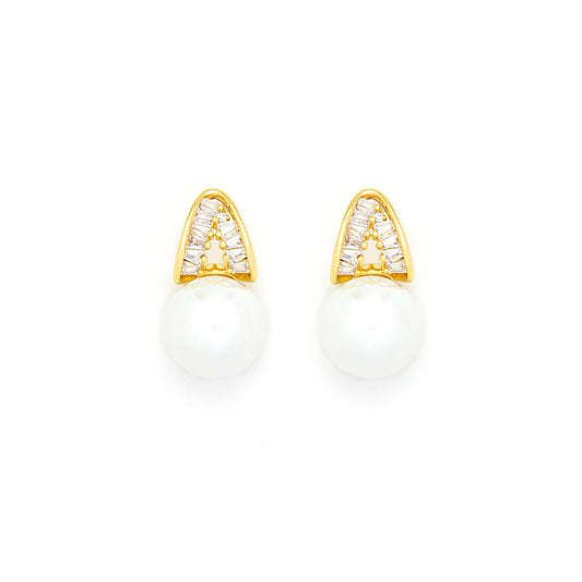 Beautiful faux pearl earrings embellished with CZ stones in baguette cut. Post fastening. 18K gold plating.