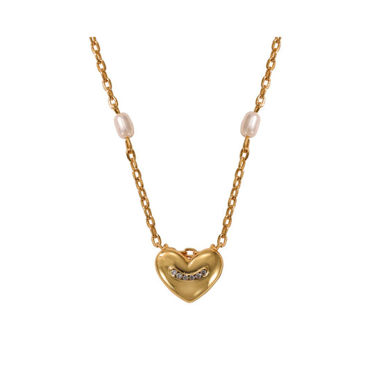 Pretty & delicate pearl & heart necklace with 10 high quality glass tiny pearls. Length 16" + 2" extension. 18k gold plated.