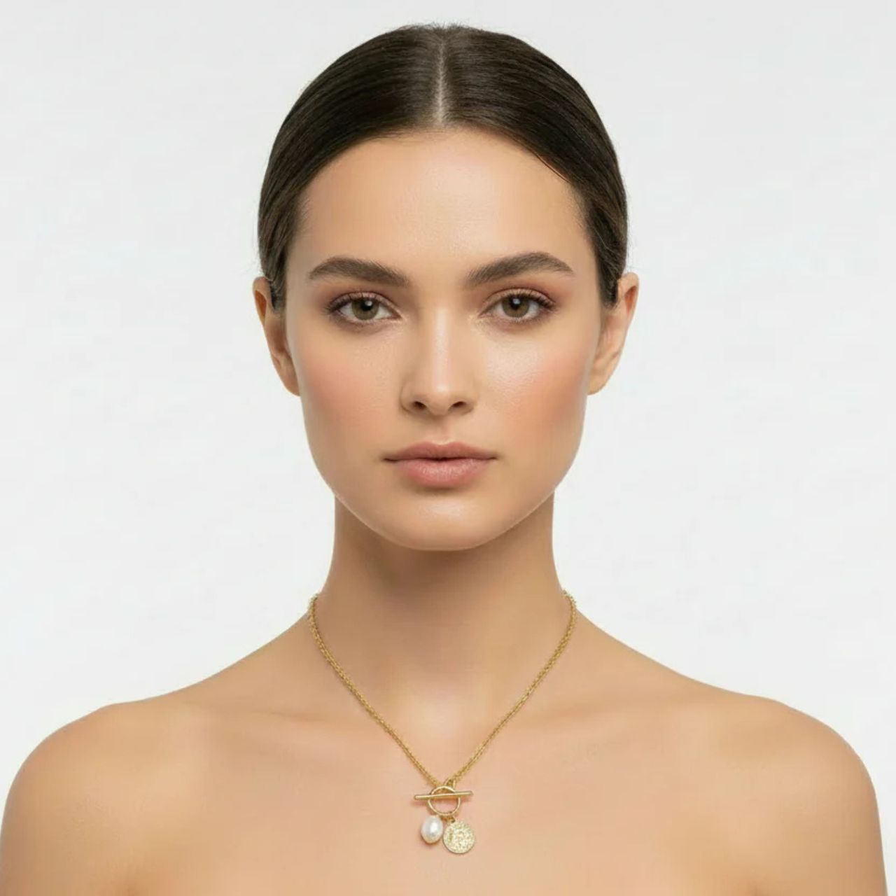 Miniature ring & toggle pendant with high quality glass pearl. Length 16" + 2" extension. 18k gold plated.