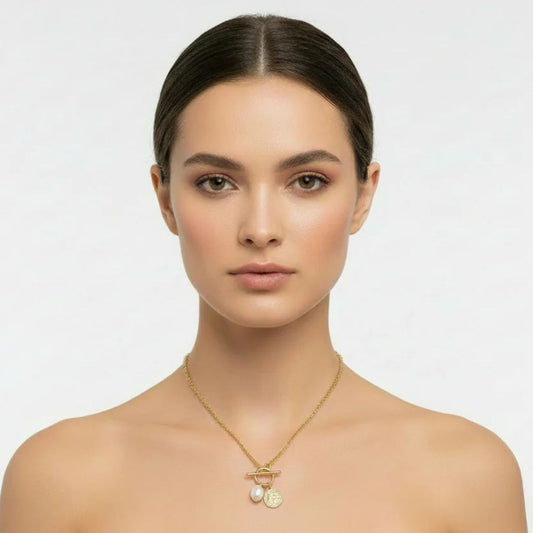 Miniature ring & toggle pendant with high quality glass pearl. Length 16" + 2" extension. 18k gold plated.