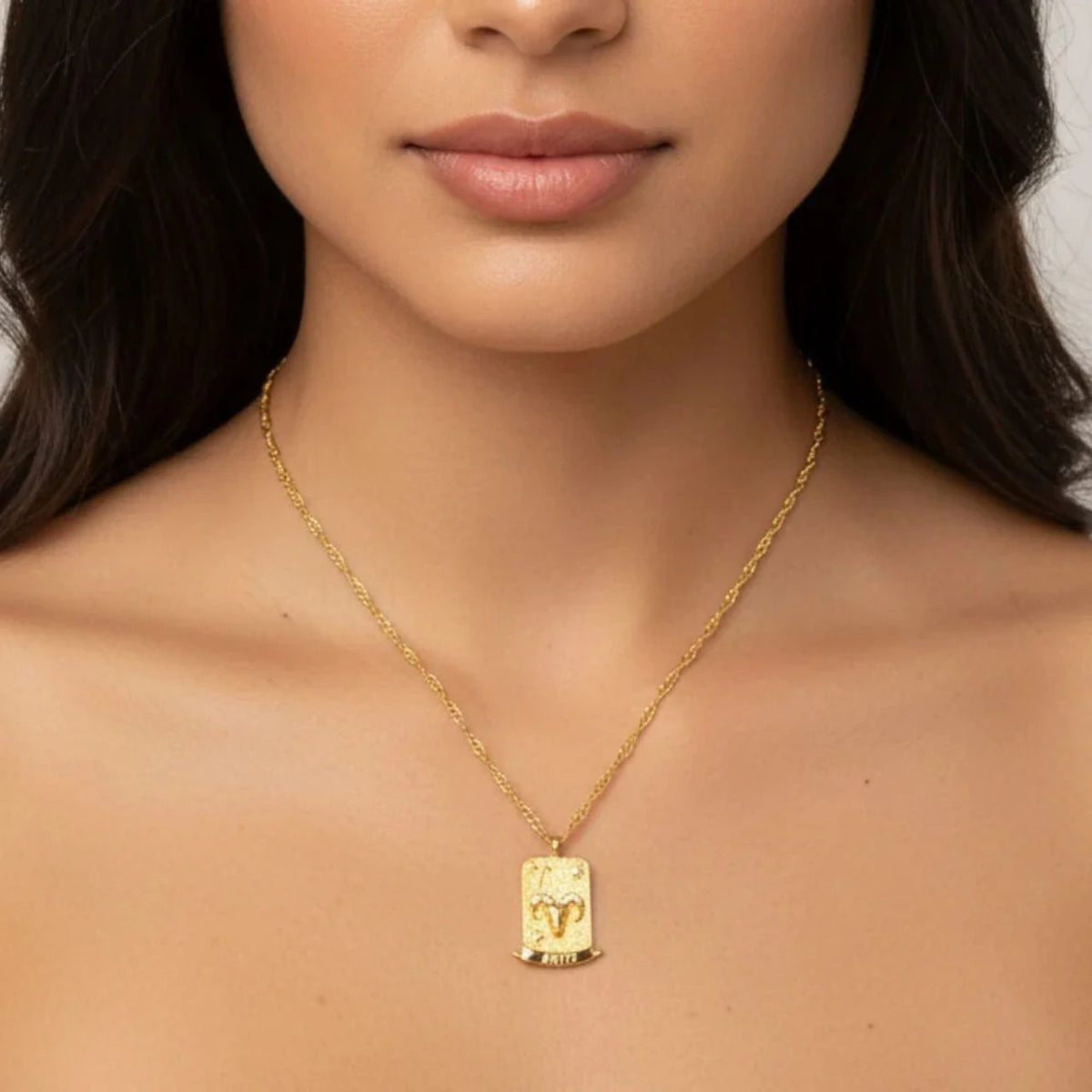 Aries Zodiac Pendant – 18K Gold Plated. Celebrate the bold and adventurous spirit of Aries, born between March 21st and April 19th, with this striking zodiac pendant.