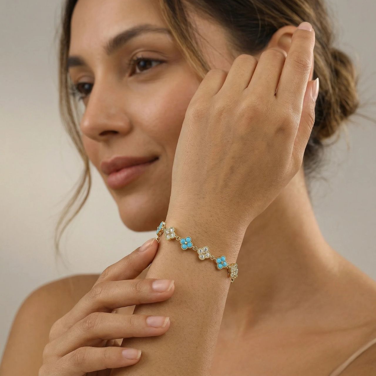 Pretty turquoise &amp; crystal clover bracelet with fold over clip fastening.