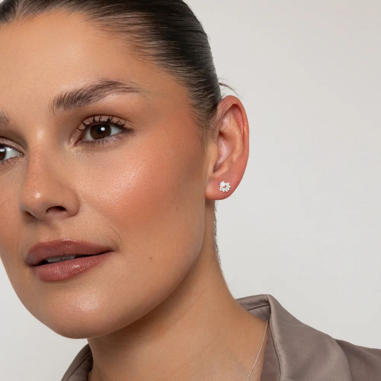 Tiny white opal style studs embellished with CZ stones.