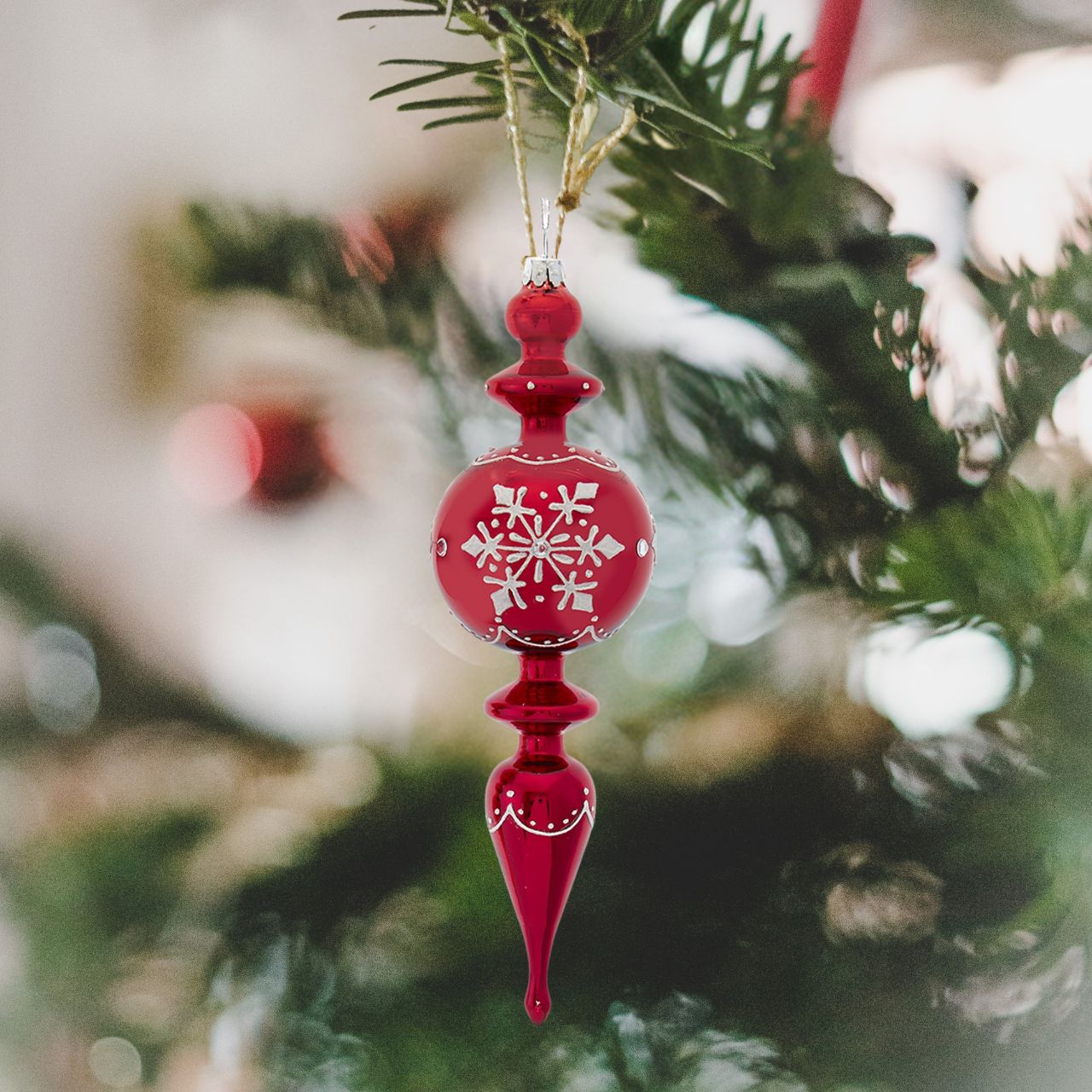 Kurt S Adler Glass Shiny Red Finial Christmas Ornament - Ball  Ball Shape Shiny Red Finial  These beautifully detailed shiny red glass finial ornaments from Kurt Adler are a festive addition to any holiday décor or Christmas tree. The glass finial is decorated with a white glittered snowflake pattern with clear gemstone accents.