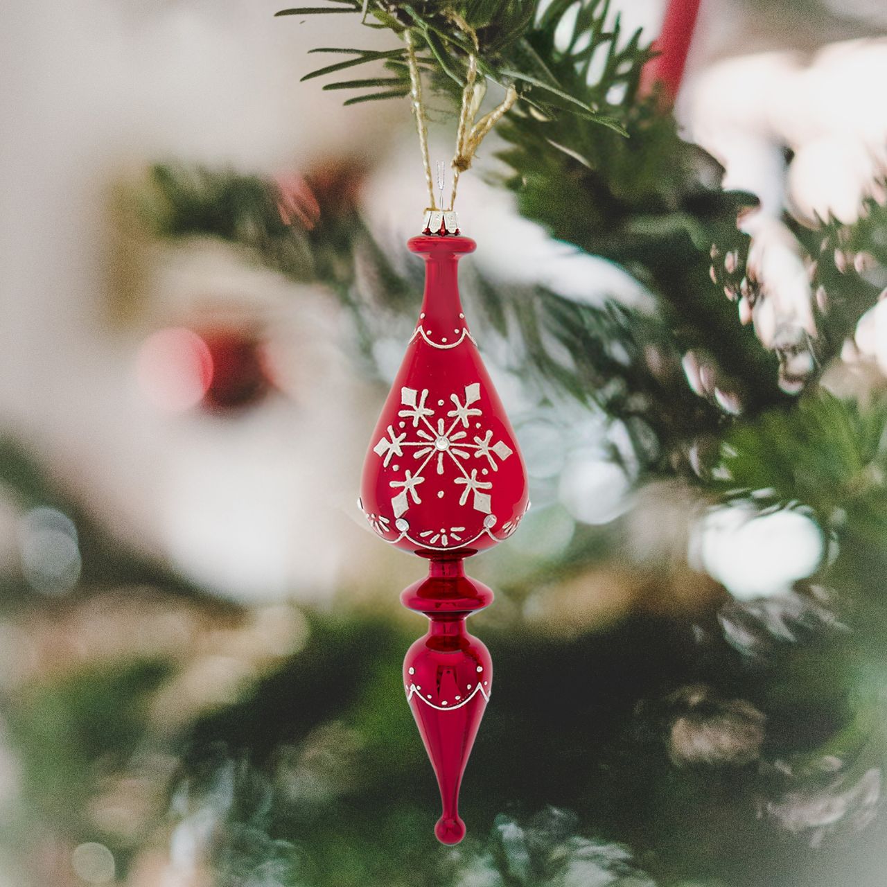 Kurt S Adler Glass Shiny Red Finial Christmas Ornament Teardrop  Teardrop Shape Shiny Red Finial  These beautifully detailed shiny red glass finial ornaments from Kurt Adler are a festive addition to any holiday décor or Christmas tree. The glass finial is decorated with a white glittered snowflake pattern with clear gemstone accents.