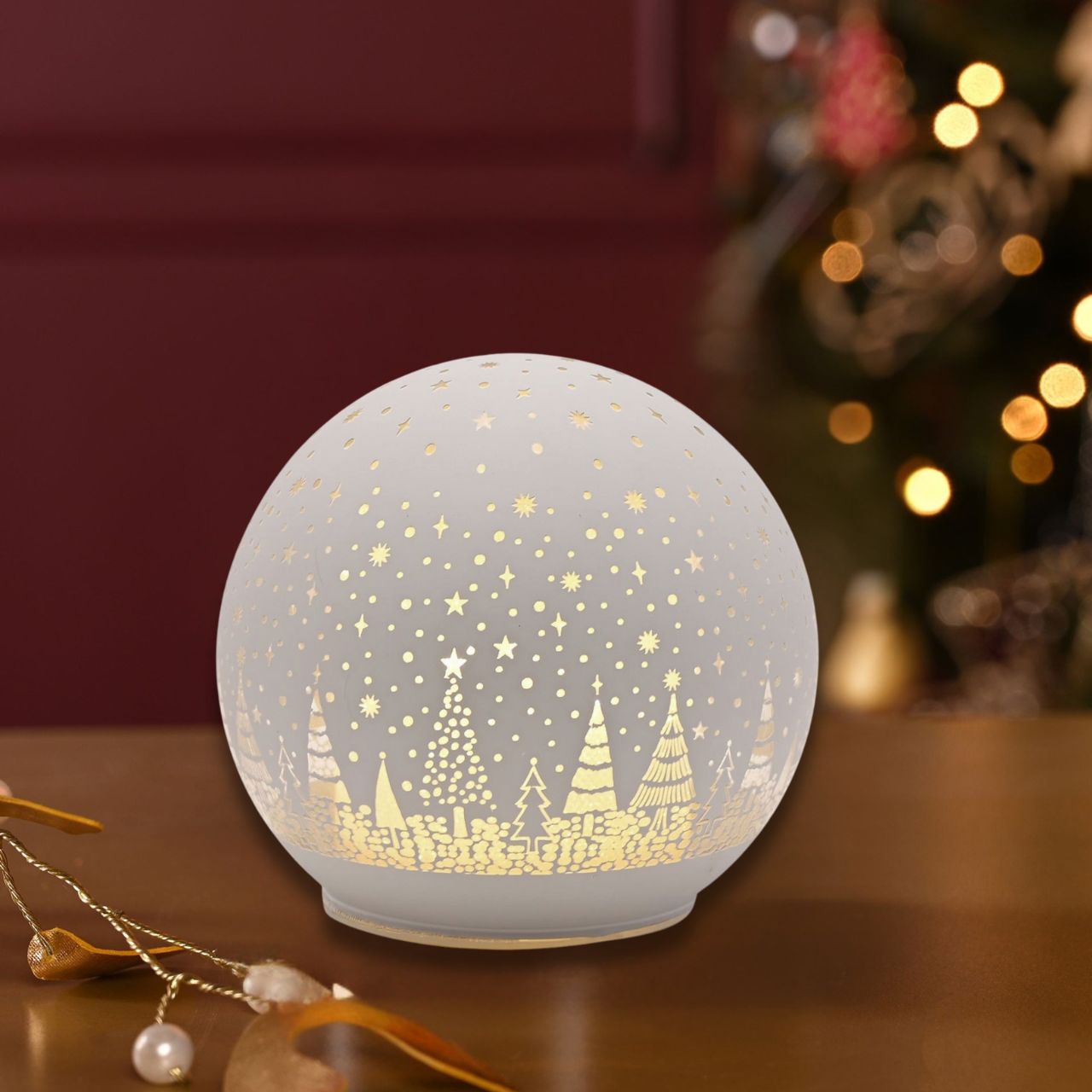 Illuminate your festive season with our 10cm White LED Glass Ball, adorned with a pattern of Christmas trees.