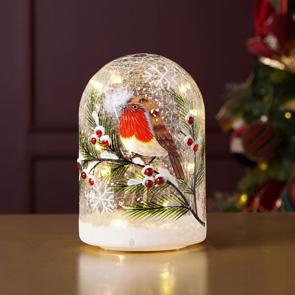 The Regal Tidings LED Domed Light Crackle Glass Robin Design (Includes try me button) brings a classic touch to festive décor.