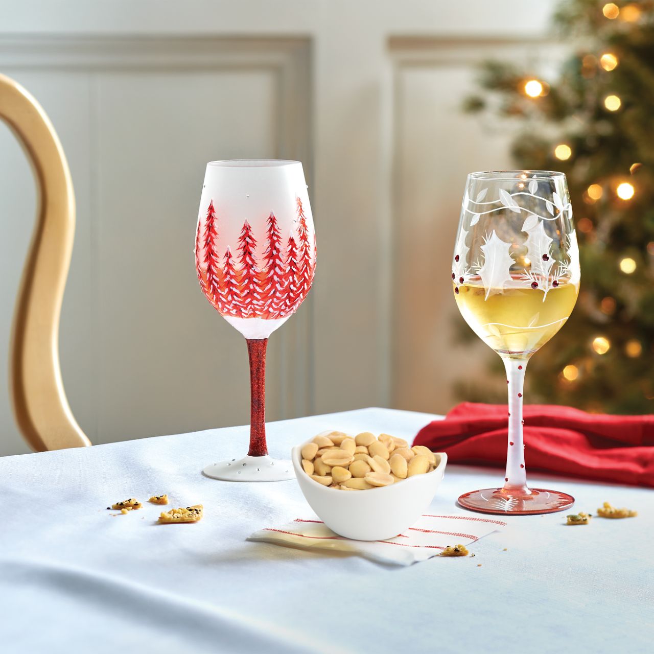 This lovely frosted wine glass enchants with a lightly painted winter forest scene. Encircled with vines and embossed holly leaves, this nature inspired cup enchants with inlaid red crystals and delicate stencilling. Have a Merry Berry Christmas.