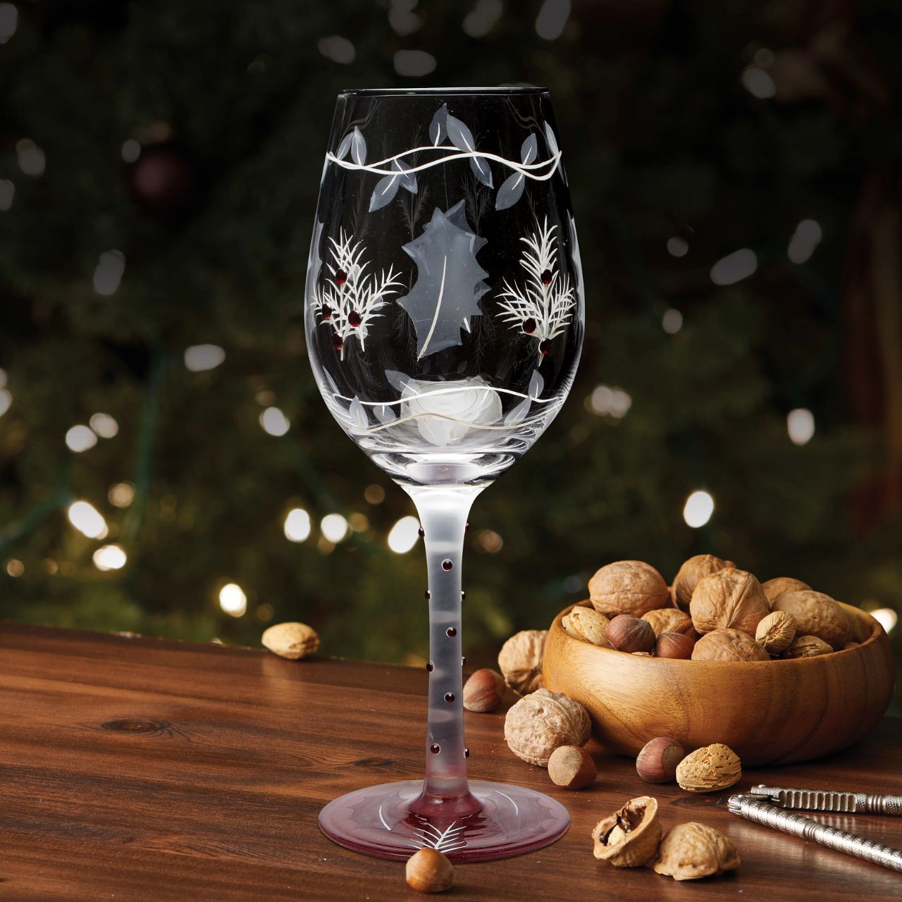 This lovely frosted wine glass enchants with a lightly painted winter forest scene. Encircled with vines and embossed holly leaves, this nature inspired cup enchants with inlaid red crystals and delicate stencilling. Have a Merry Berry Christmas.