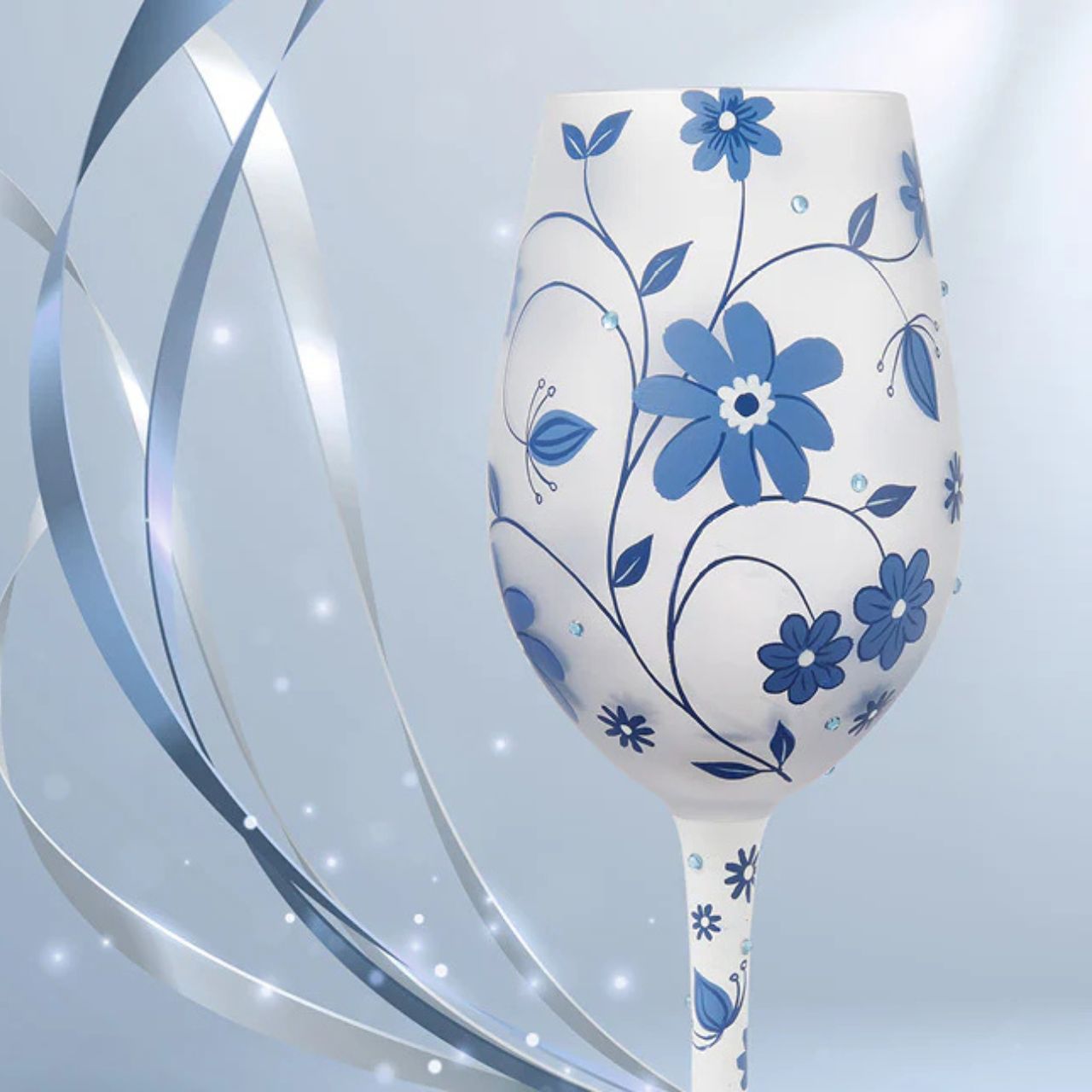 This gorgeous Chinoiserie cup from Lolita Designs features hand-painted flowers on frosted glass. With inlaid crystal details, this beautiful blue wine glass honors the exotic and luxurious style of beloved 19th century Chinoiserie decor.