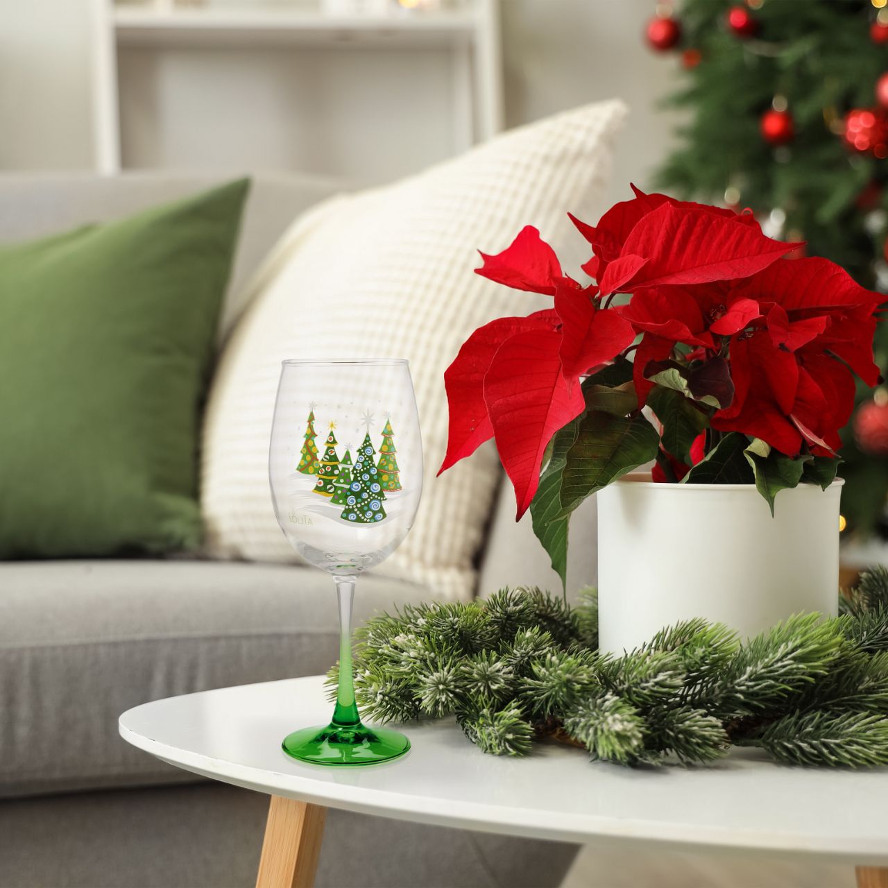 Toast to the most wonderful time of the year with this Celebrations by Lolita wine glass, featuring a transparent gradient effect and Christmas trees. A snowy scene of decorated greenery, fill your cup with all kinds of spirit. This Lolita glass comes in an acetate gift box.