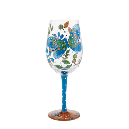 Add a touch of elegance to your collection with this enchanting Garden Butterfly Wine Glass by Lolita. This exquisite hand-painted piece captures the beauty and grace of a butterfly in flight, set against a backdrop of intricate floral designs.