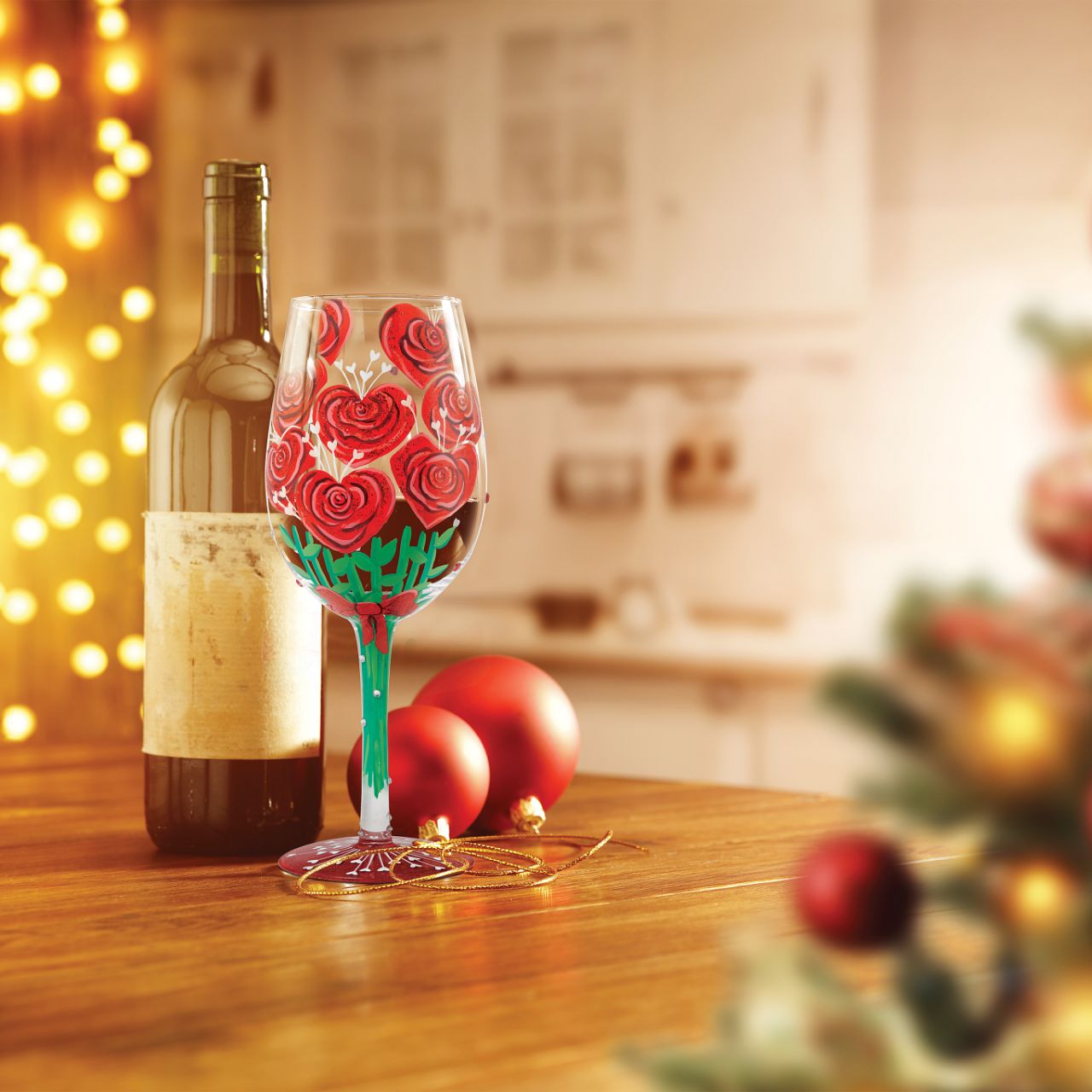 Elevate a romantic evening with this unique wine glass from Lolita showcasing a stunning bouquet of hand-painted red roses crafted into the shape of hearts.