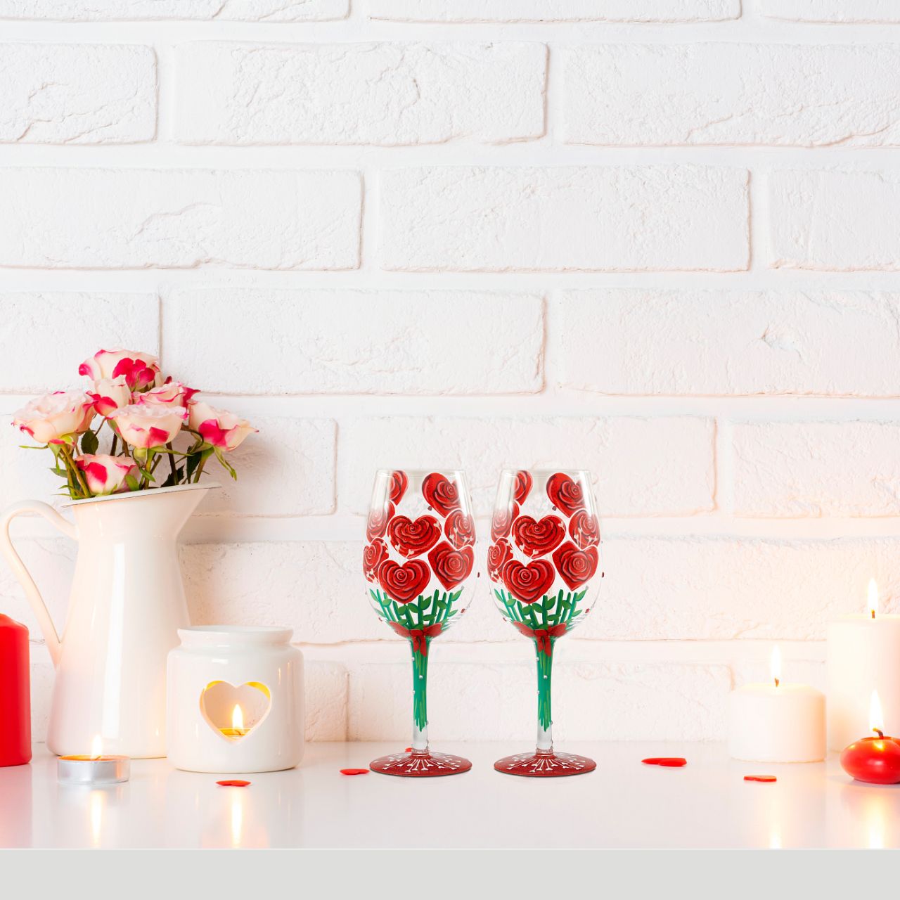 Elevate a romantic evening with this unique wine glass from Lolita showcasing a stunning bouquet of hand-painted red roses crafted into the shape of hearts.