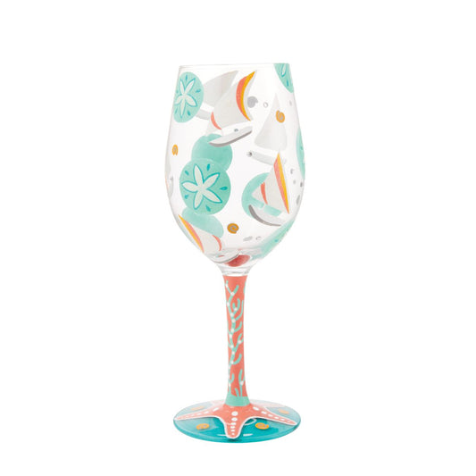 The Sailboats &amp; Sand Dollars Wine Glass by Lolita is a stunning Summer accessory, whether you're sailing or sunbathing| Bright blues combine with punchy coral pink to make a joyous ode to days at the beach.