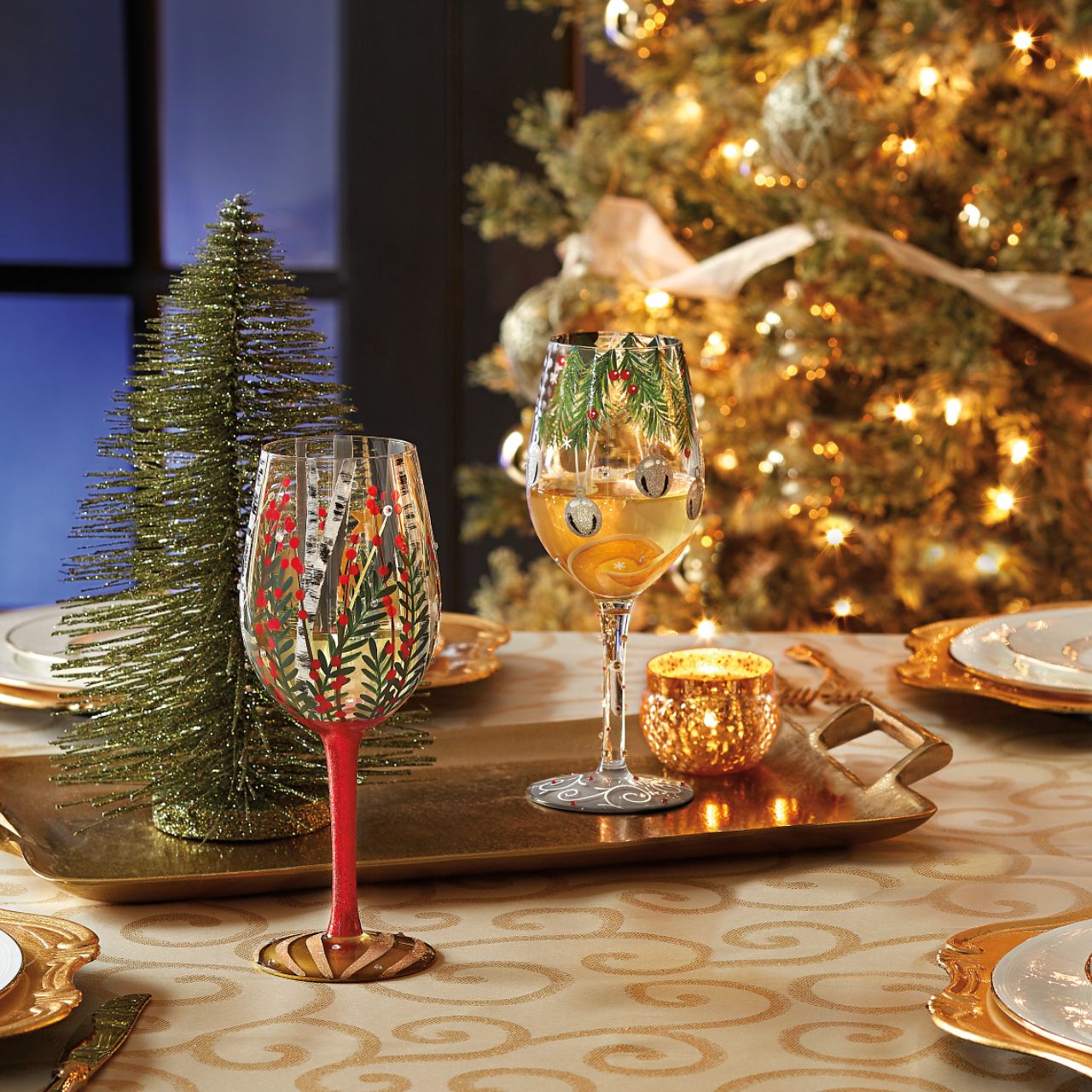 Visions of Christmas Birch Wine Glass by Lolita   Take a Christmas walk with our Visions of Birch Wine Glass by Lolita. Surrounded by beautifully decorated Christmas branches, a full red glittered stem and a gold Christmas bauble on the bottom of the glass this wine glass radiates Christmas all year round.