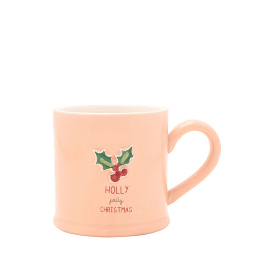 Classic stoneware mug in a soft pastel pink with a 3D embossed holly and with the words 'Holly Jolly Christmas'. In a gift-ready box, this is the ideal everyday mug to add a little seasonal spirit to any home!