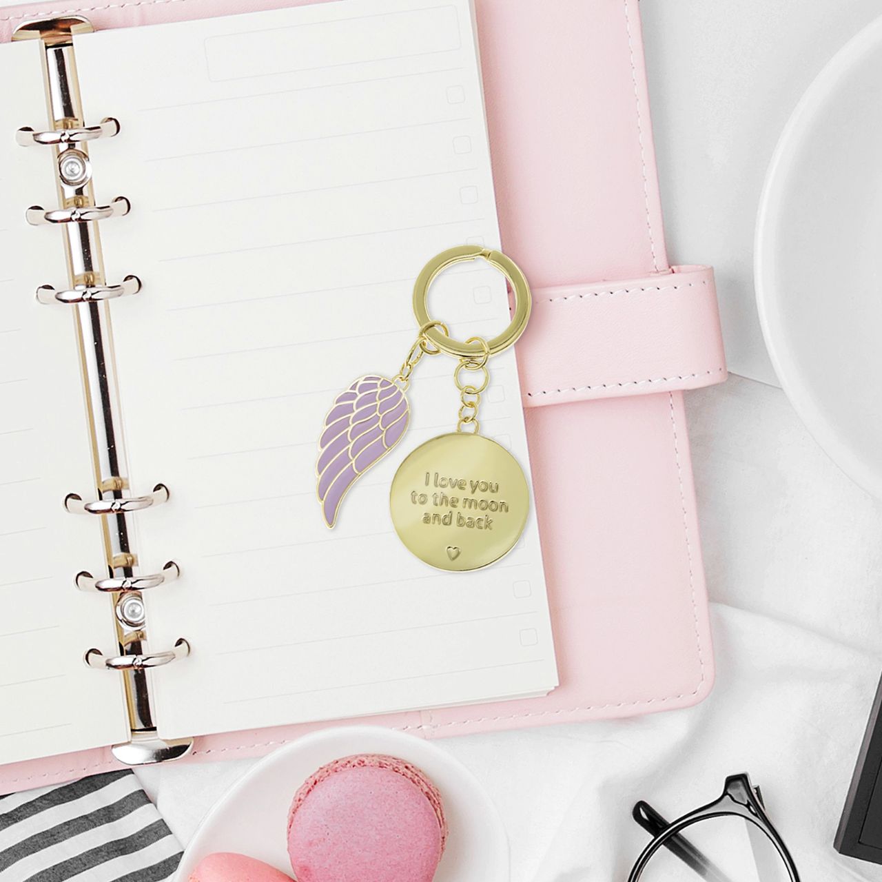 Introducing 'Love you to the moon and back' Keychain. A heartful token nestled in a gold embossed gift box. Symbolising boundless affection, perfect for expressing infinite love and cherished connections.