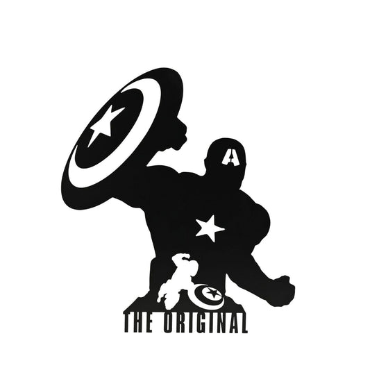 Infuse your space with a touch of superhero allure with our Marvel The Avengers Captain America Wall Plaque. This striking piece features a silhouetted figure holding a star-emblazoned shield, beneath the bold declaration: "THE ORIGINAL".