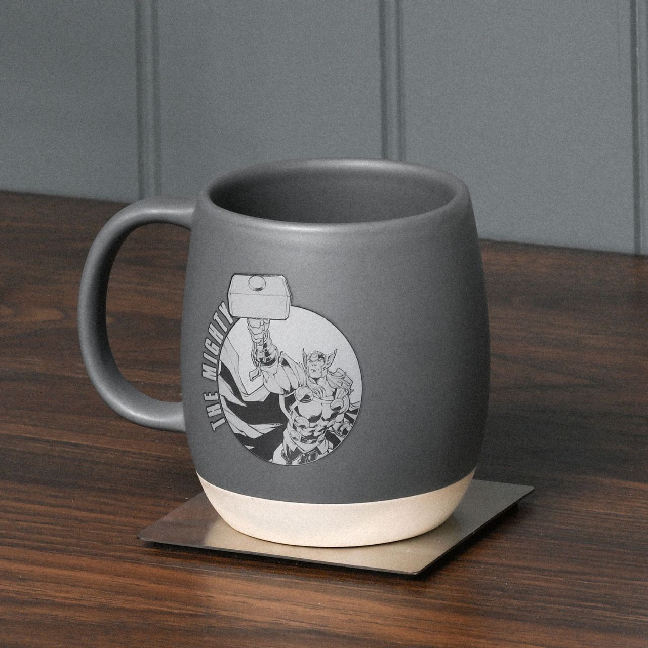 Unleash your inner superhero with the Marvel Avengers Thor Mug, a striking addition to any coffee break. Displaying the iconic Avengers logo in a sleek grey ceramic backdrop, it's a must-have for fans of the legendary comic series.