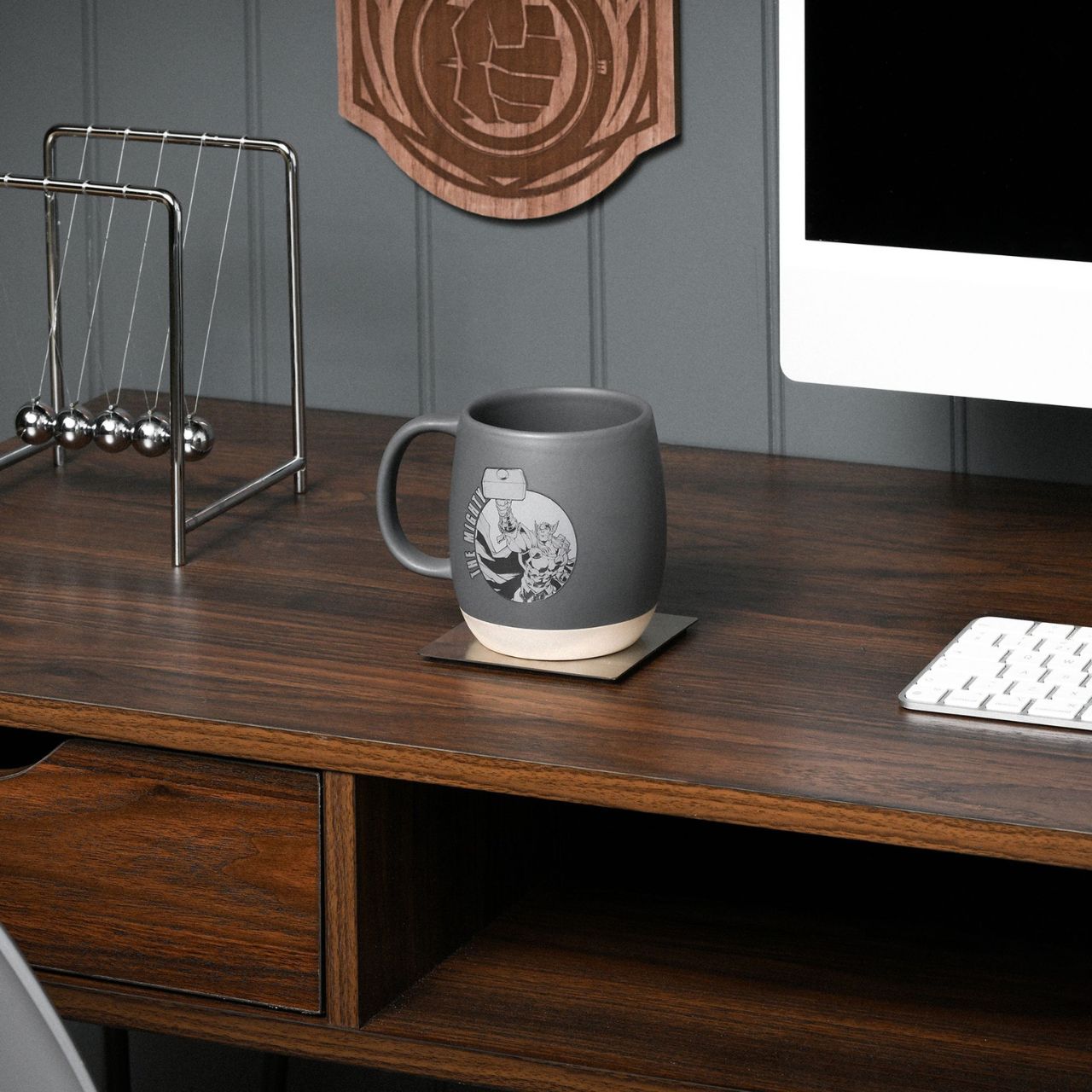 Unleash your inner superhero with the Marvel Avengers Thor Mug, a striking addition to any coffee break. Displaying the iconic Avengers logo in a sleek grey ceramic backdrop, it's a must-have for fans of the legendary comic series.