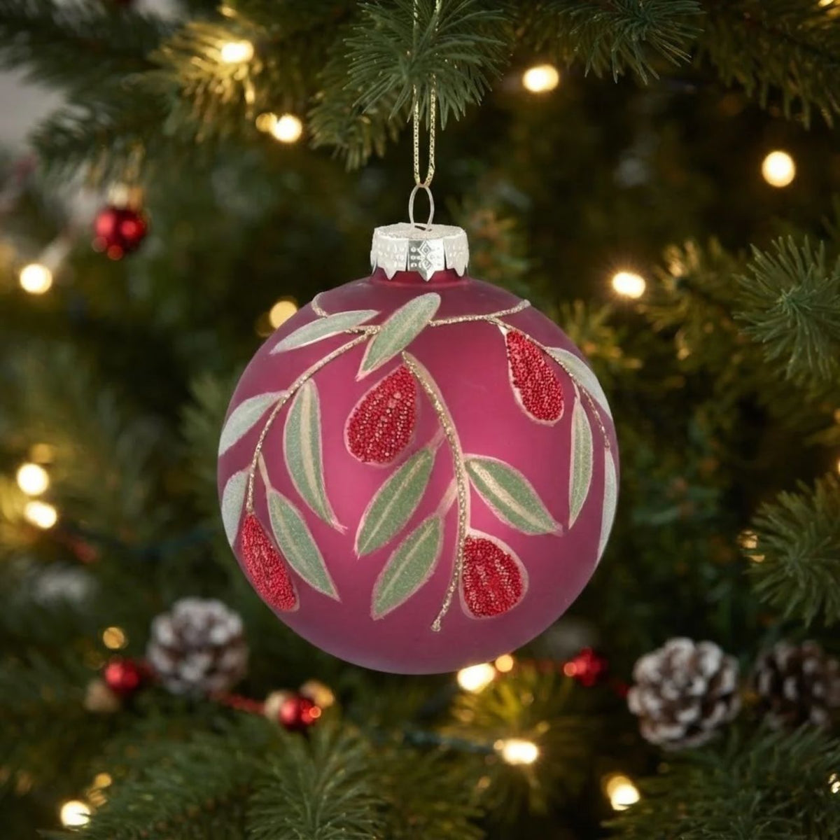 Gisela Graham Matt Cerise Glass Bauble with beaded fruit and leaf embellishments. This elegant Christmas ornament combines rich cerise tones with intricate beaded detailing for a sophisticated festive look.