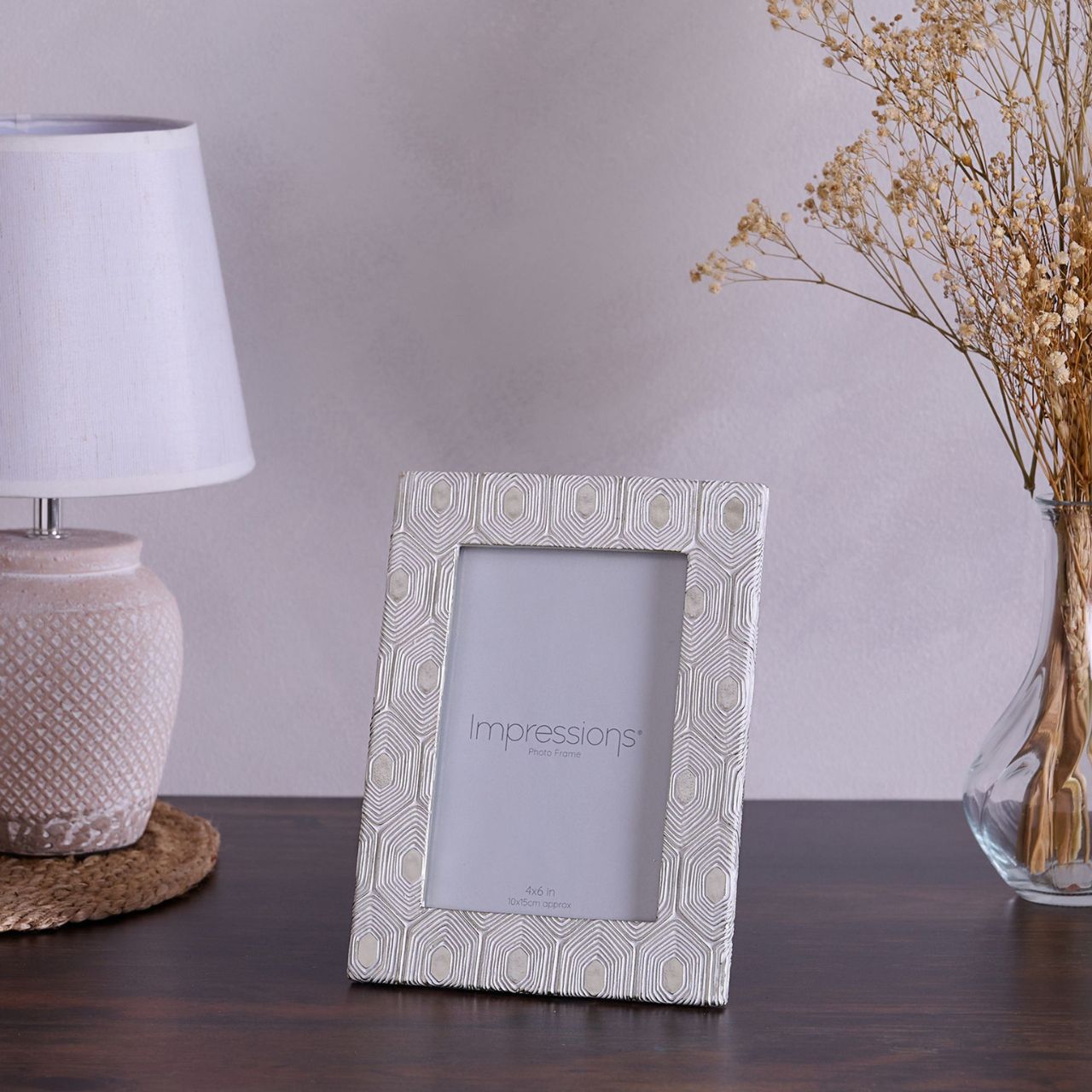 This attractive frame will enhance both the photographs within it and the room it sits within.