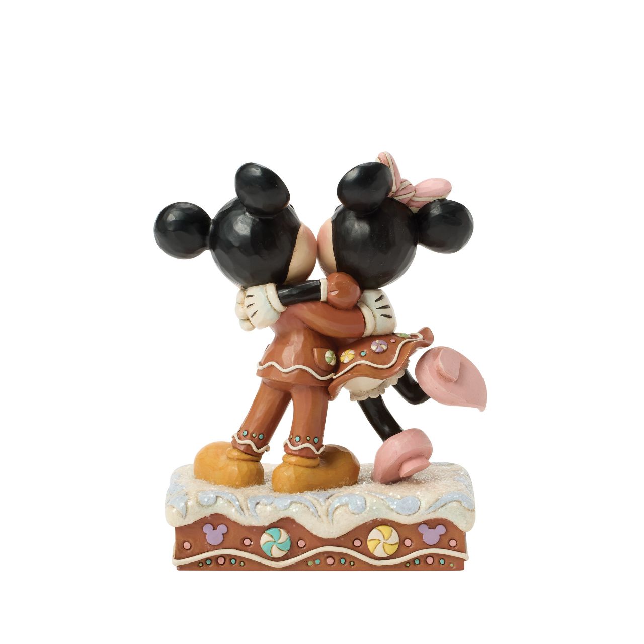 Sweet as sugar, Mickey and Minnie Mouse are decorated like gingerbread cookies in this charming Jim Shore holiday design. With peppermints and rosemaling accents, they look fresh from the oven and full of Christmas cheer as they embrace with love.