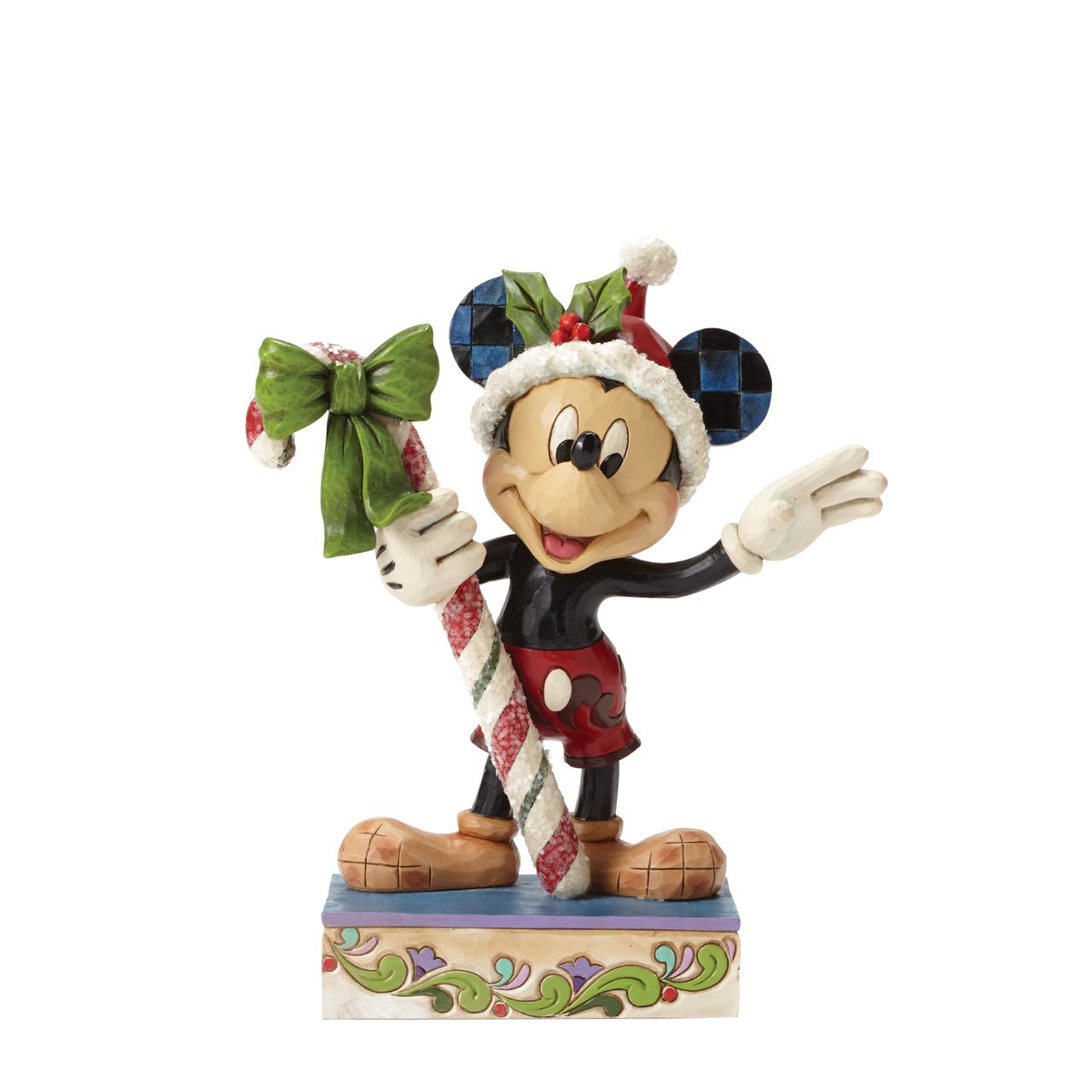 Disney Mickey Mouse Candy Cane Figurine  "Sweet Greetings" A jolly Mickey Mouse brings a gift of sugar coated candy in this delightful Christmas design from the artistry of Jim Shore. Beautifully handcrafted, this eye-catching piece features the classic Disney character decorated in Jim's unique folk art style.