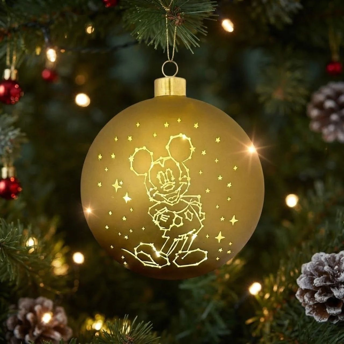 Brighten your Christmas tree with this enchanting Disney Mickey Mouse Stars Lighted Christmas Bauble. Featuring beloved Mickey Mouse surrounded by twinkling stars, this illuminated ornament brings festive magic to your holiday display.