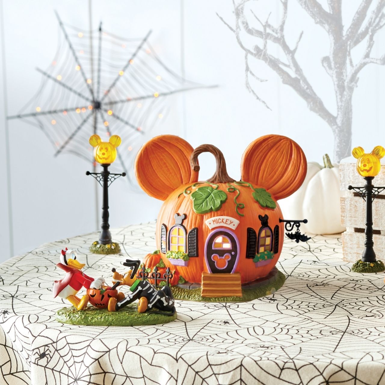 All decked out for the fall, "Mickey's Pumpkintown House" is ready for trick-or-treaters to visit. With pumpkins in the yard, and his name over the door, Mickey is ready for the big night.