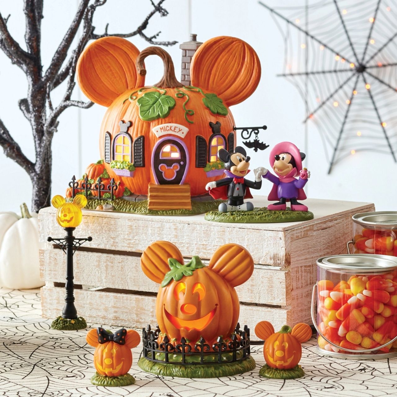 All decked out for the fall, "Mickey's Pumpkintown House" is ready for trick-or-treaters to visit. With pumpkins in the yard, and his name over the door, Mickey is ready for the big night.