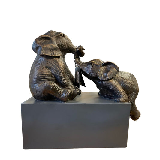 This charming elephant sculpture is a conversation starter and is the perfect illustration of the elephants' strong family bonds and of what can be achieved when you work together. A truly beautiful piece mounted on a black base.