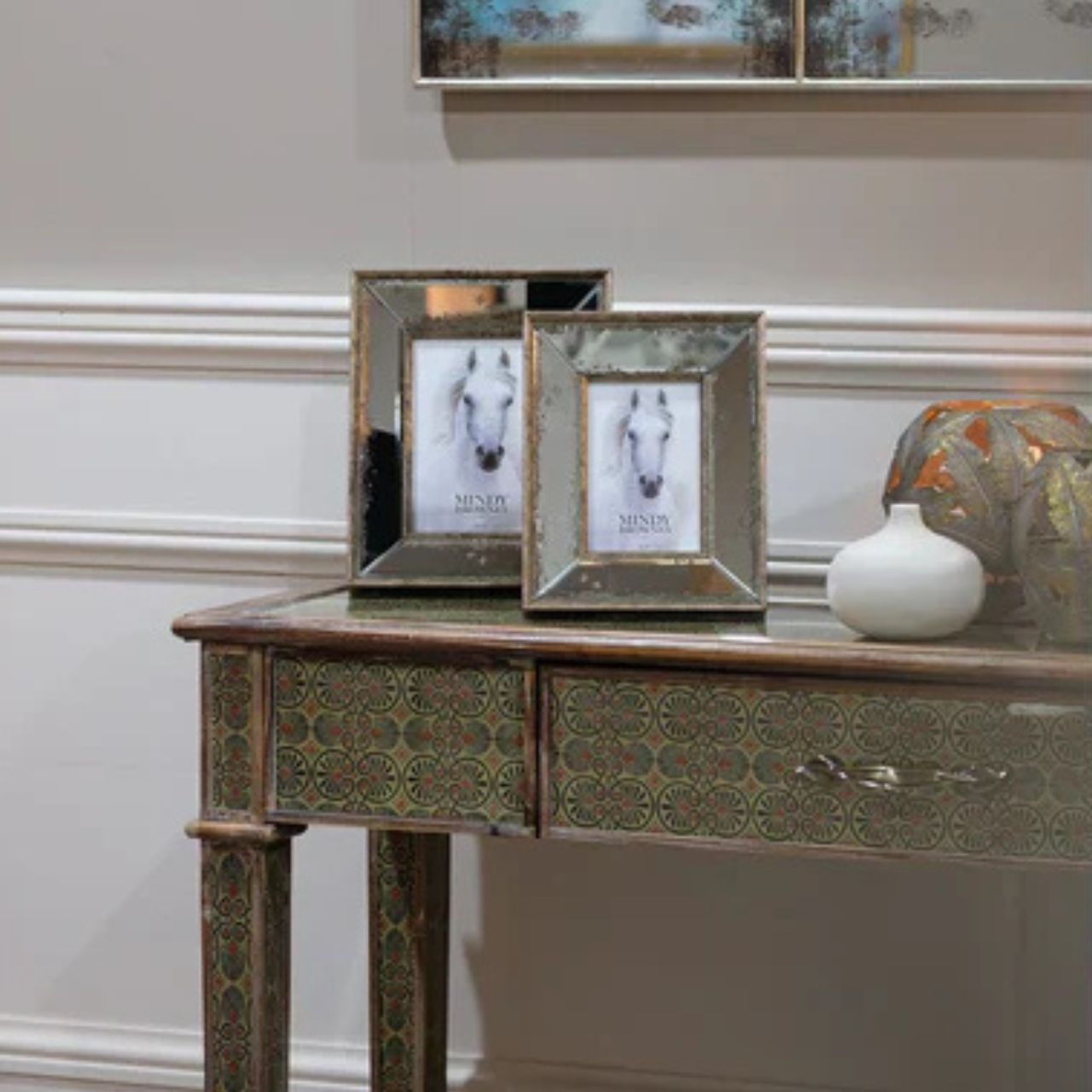 A striking 1960s retro-inspired console table with a draw for storage. A stunning vine-like detailing is used on the handles and instantly adds a sense of intrigue and life.